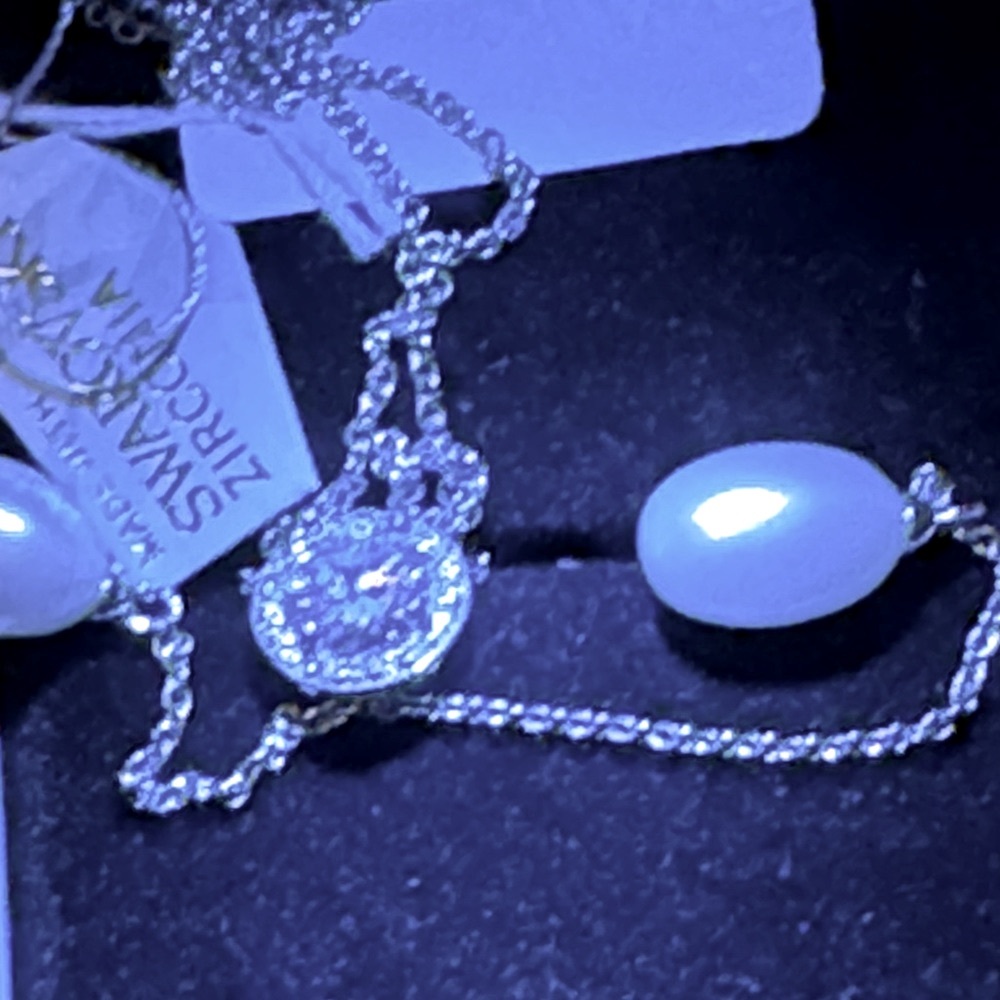 New Exquisite Swarovski crystal complemented by cubic zirconia and pearls.